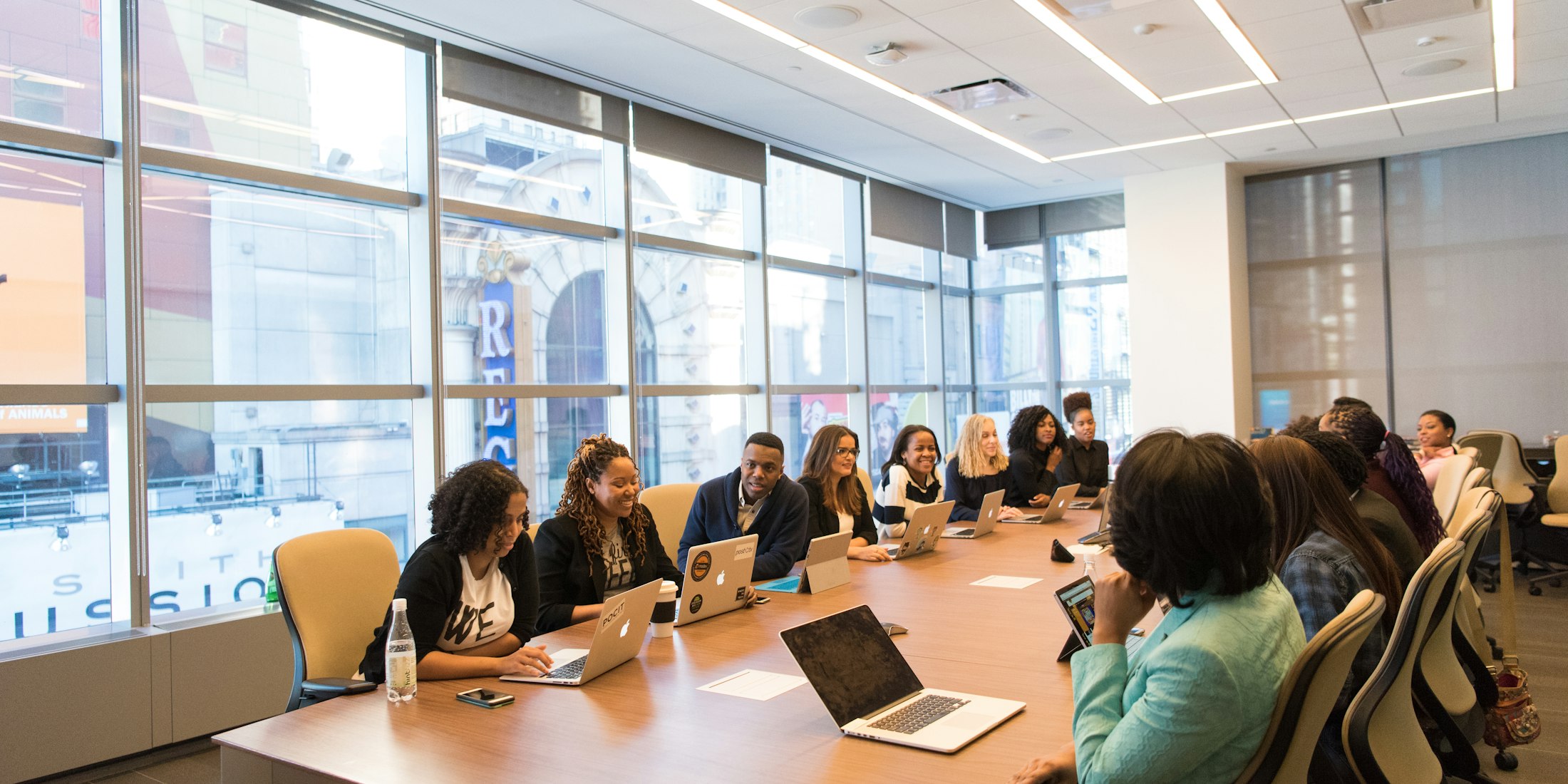Leadership team in a strategy session around a boardroom table