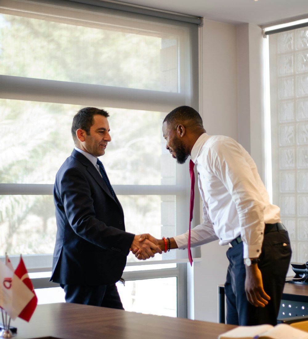 Two executives shaking hands after a successful hire