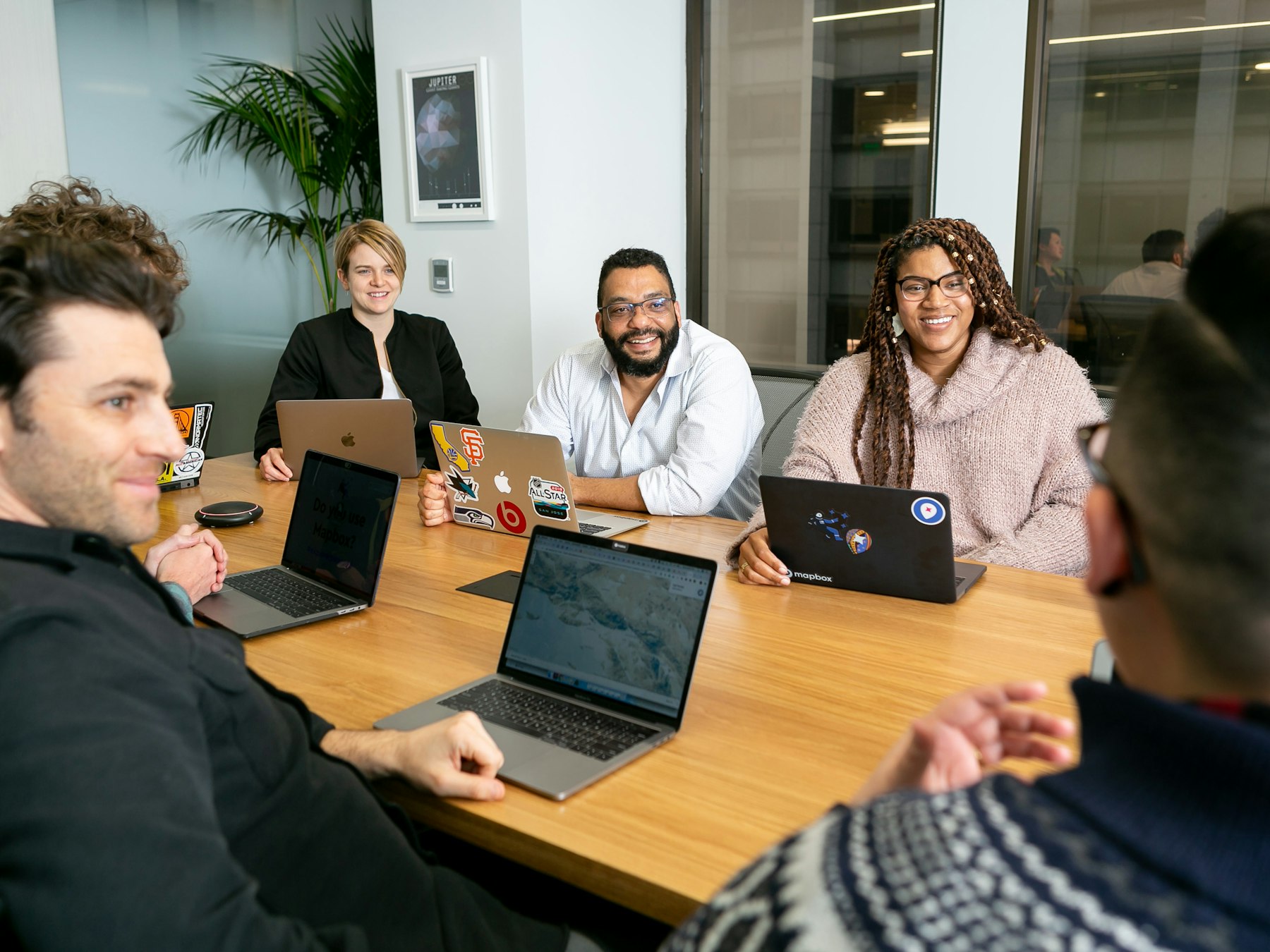 Team reviewing a website project in a meeting