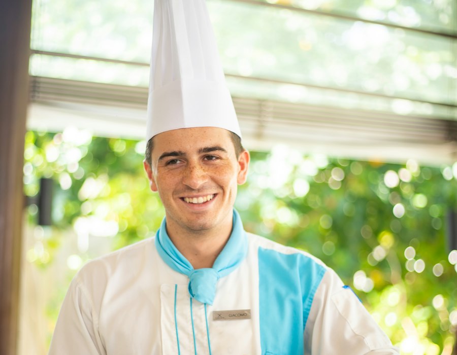 Smiling chef representing a hospitality brand