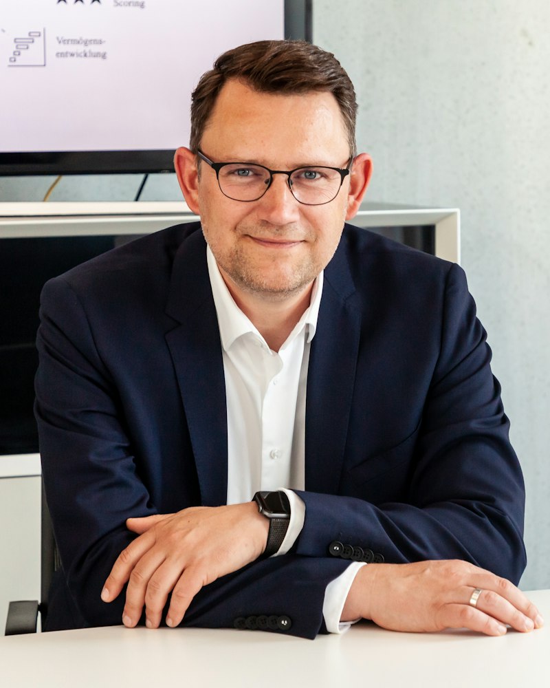 Business owner in a suit at his desk