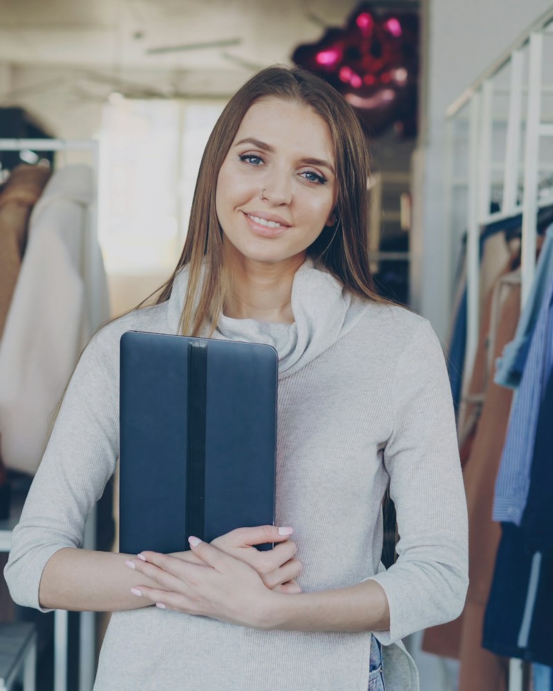Boutique owner in her branded clothing store